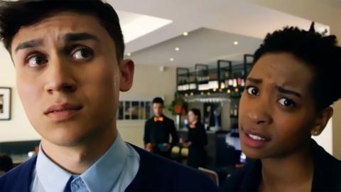 A man and a woman looking at each other whilst being confused and worried.