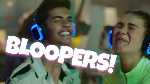 Nate and Chloe are wearing headphones at the disco, they are both laughing hysterically after having messed up their lines. The word "bloopers" is on them.