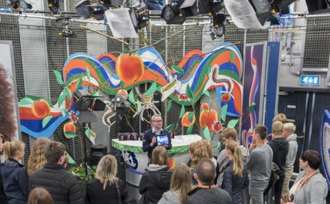 A tour guide shows round visitors to the Blue Peter studio on a BBC Tour of MediaCityUK