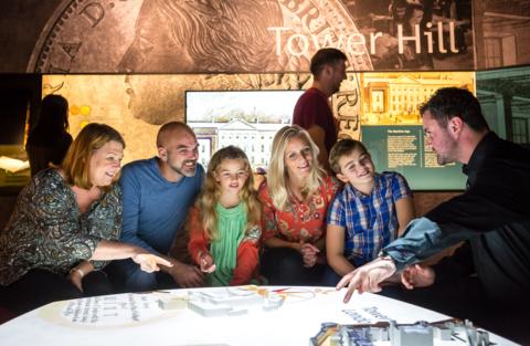 visitors looking at a display at The Royal Mint