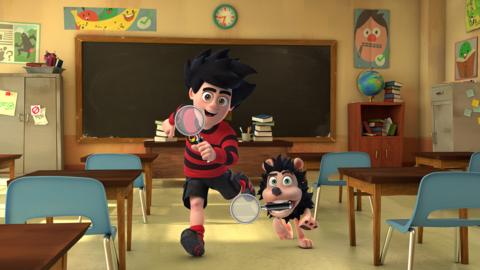 Dennis and Gnasher are carrying magnifying glasses in a classroom.