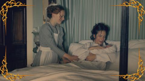 A red-haired serving girl (Hetty) watches an exhausted looking woman, sitting up in bed with a baby in her arms after giving birth.