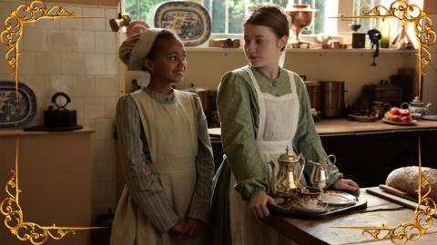 A young girl carrying a tray while a girl stands next to her looking expectant, set in a gold frame.