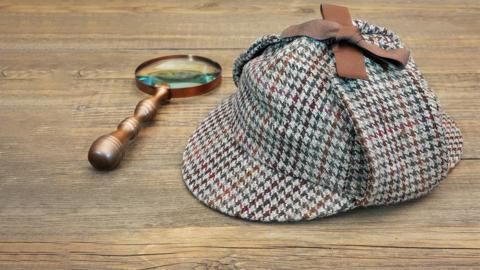 Magnifying glass and Deerstalker hat