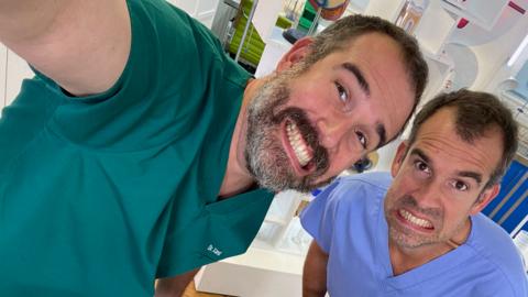 Doctors Chris and Xand pose for a selfie in the lab.