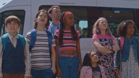 The Dumping Ground kids are outside of the new house