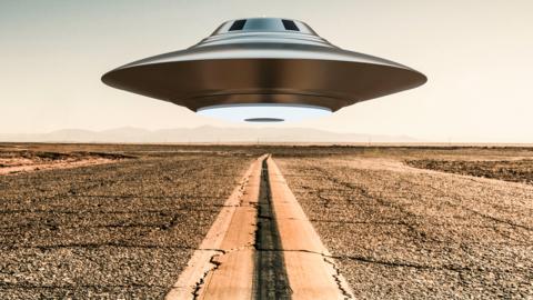 UFO floating above the road