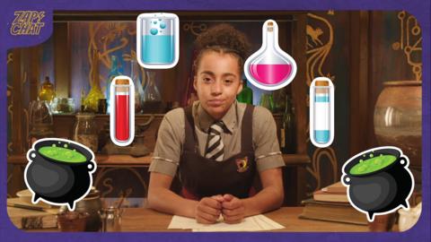 A young witch (Indie) in a Cackle's Academy uniform, looks stressed, surrounded by potions and cauldrons.