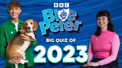 On the left, Joel is in a green jacket and holding Henry the dog. Abby is on the right in a pink top, smiling at the camera. Text reads: Blue Peter big quiz of 2023