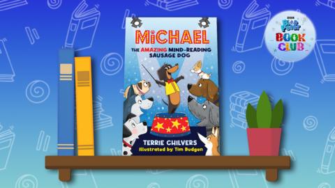 The book 'Michael the Amazing Mind-Reading Sausage Dog' sits on a Blue Peter background.