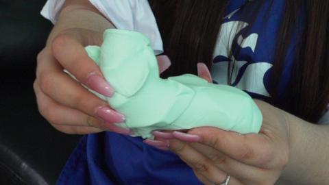 Karina Garcia with turquoise slime.