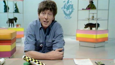 John Noakes at the classic Blue Peter makes table talking to camera.