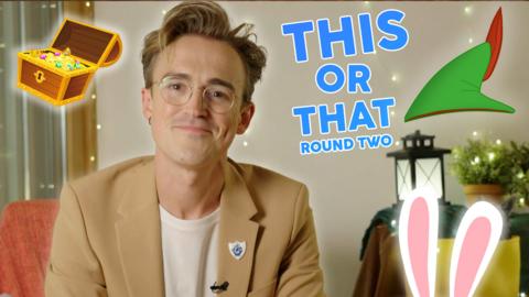 Tom Fletcher wearing a beige blazer jacket, there are cartoon rabbit ears, a treasure chest and Peter Pan's hat around him.