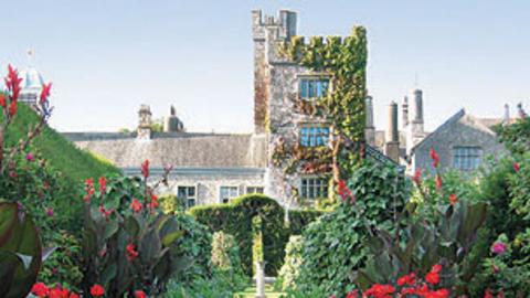 The outside of Levens Hall covered in moss.