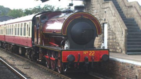 A steam train at a station