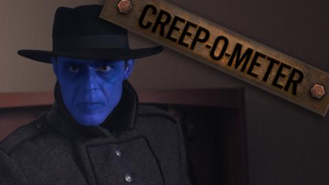 A blue man wearing a black hat and coat.