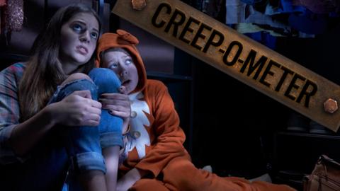 A teen girl and young boy hide in a wardrobe looking frightened.