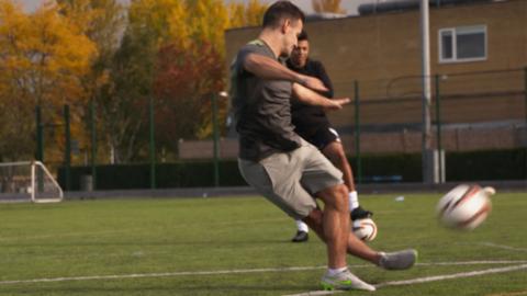 Danny Care kicking a football.