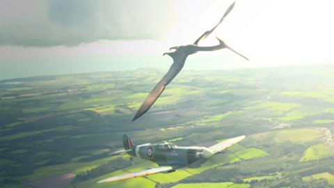 A Spitfire plane and a flying dinosaur.