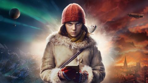 A young girl dressed in warm adventure gear, looks down and holds a square instrument in her hands while a small white ferret like creature stands on her shoulder, Lyra and Pantalaimon from His Dark Materials.