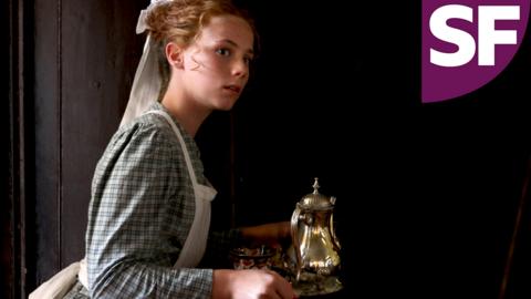 A young girl in Victorian servant outfit looking curious.