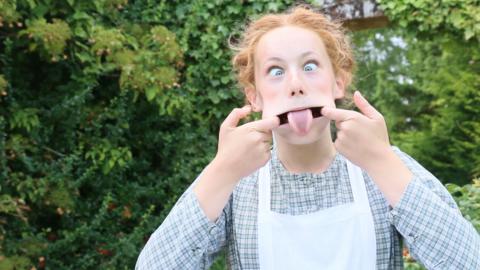 Girl pulling a funny face. Isabel Clifton (Hetty Feather).