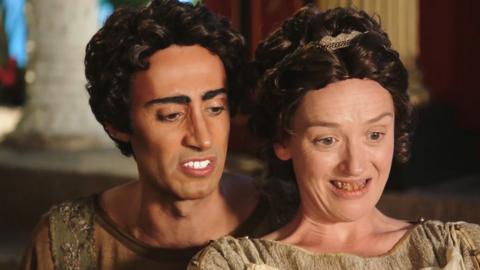 Two romans smiling.