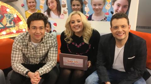 Sam and Mark sat on the sofa with Cý's Katie for Junior Bake Off: The After Party.