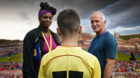 Jamie Johnson is facing away from the camera, with the Gothia Cup stadium in the background.