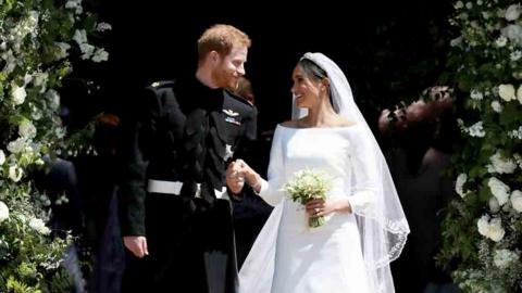 Harry and Meghan at the steps of St. George's chapel.