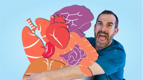 A doctor in scrubs looking panicked while holding a large group of cartoon looking organs.