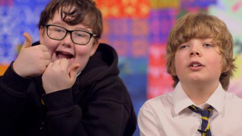 Two boys looking excited.