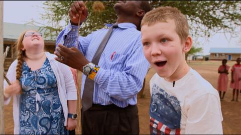 A young boy looking shocked.