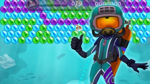 Cartoon scuba diver floating in a plastic polluted ocean. There is a bubble pop game in the ocean. The aim of the game is to pop the matching bubbles and save the seas.