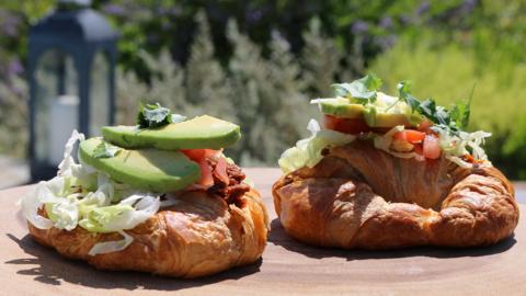 Croissants topped with avocado and salsa.