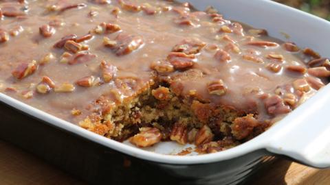A rectangular dish with sticky toffee pudding inside.