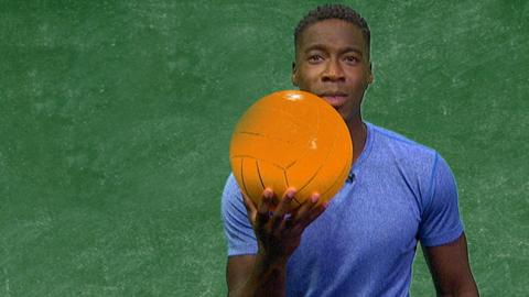 Christian Malcolm holding a polo ball.