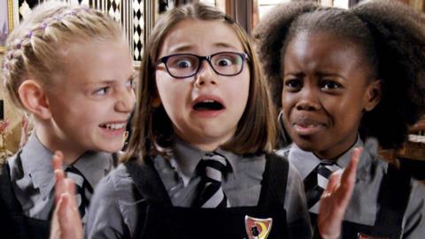 Close up on three girls' faces in school uniform. Sybil Hallow, Clarice Twig and Beatrice Bunch from The Worst Witch.