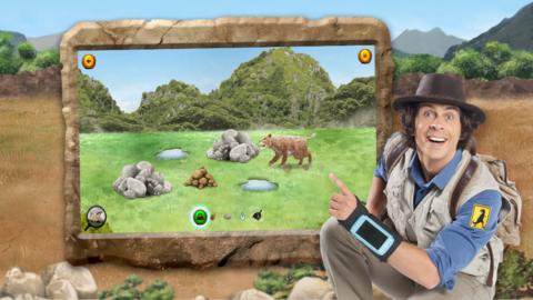 Andy next to an image of the Andy's Prehistoric Park game