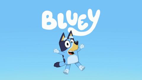 Bluey is starjumping, smiling to camera. Above her is the word 'Bluey', they are against a blue gradient background.