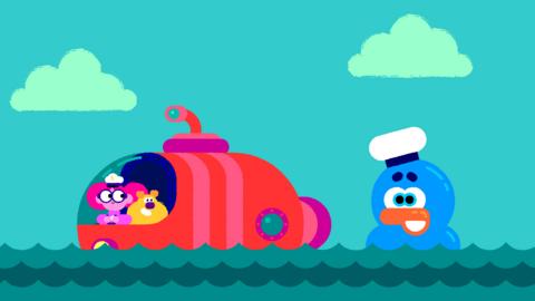 Maddie and Triggs in a submarine with a rubby duck on the sea.