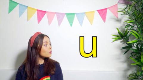 Evie teaches us how to pronounce letters.