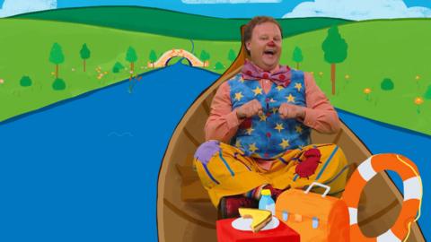 Mr Tumble in a rowing boat