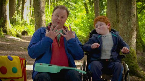 Justin and a friend doing Makaton