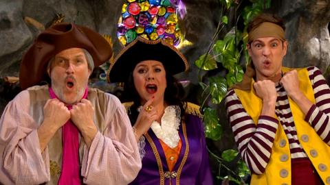 Pirates Seaweed and Sandy are stadning next to Captain Captain, all with shocked faces.