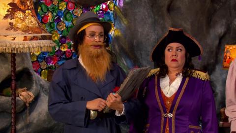 Captain Captain andd a Pirate inspector who has a beard, glasses and a top hat.