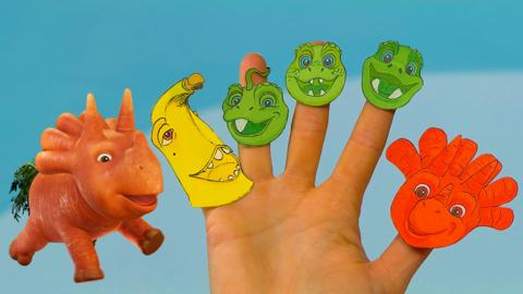 Illustration of Ginger from Vegesaurs, next to a hand that has Vegesaurs character finger puppets on.