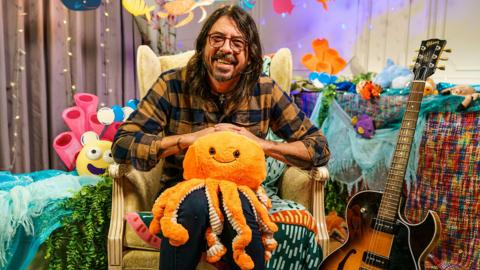 Click to watch Dave Grohl read Octopus's Garden for CBeebies Bedtime Stories.