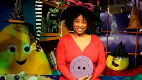 Click to watch Shauna Shim read Witchety Sticks and the Magic Buttons for CBeebies Bedtime Stories.