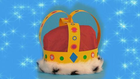 A colourful crown decorated with stickers.